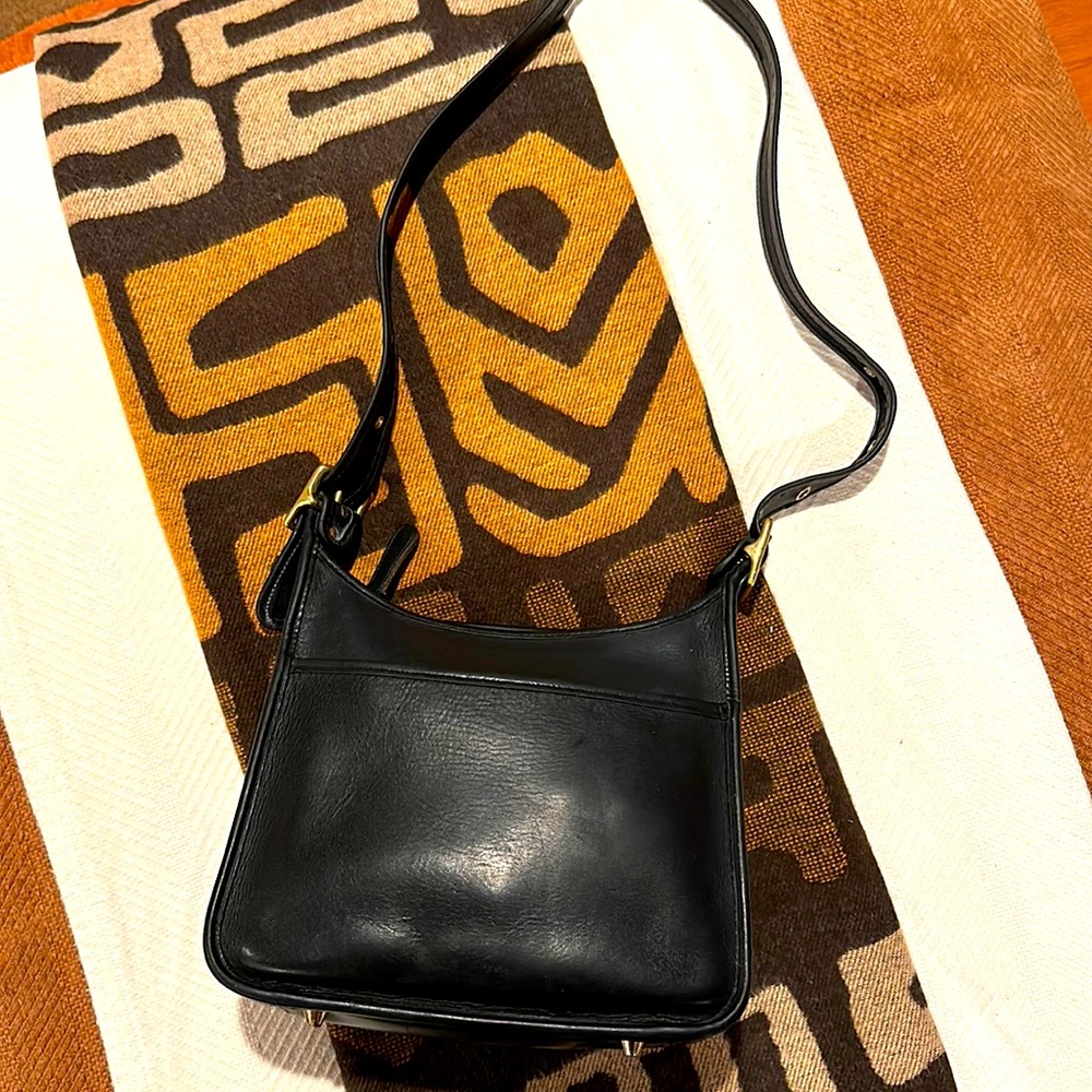 Coach bag black with shoulder strap/cross body strap.